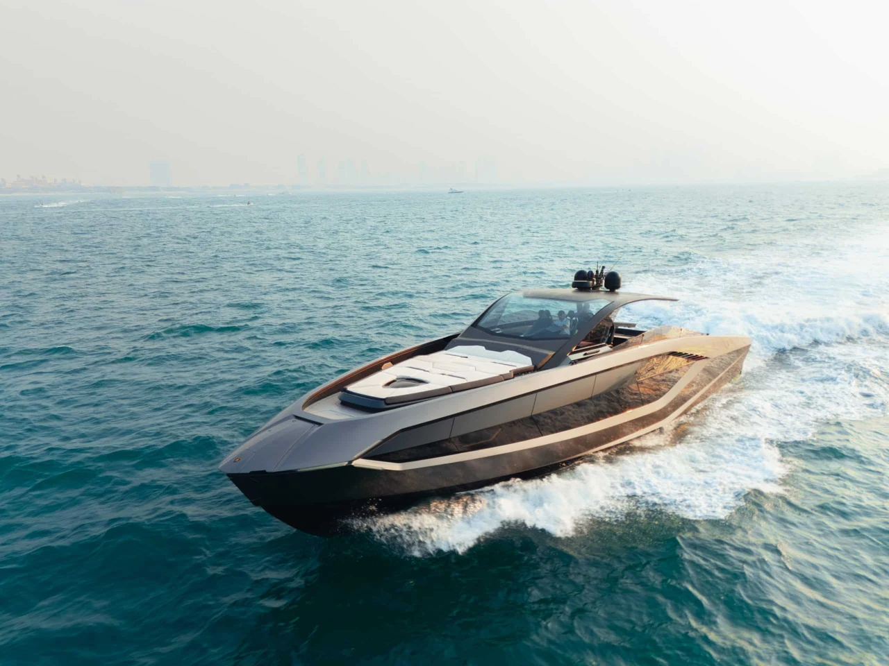 Lamborghini 63 cruising on open water in evening light