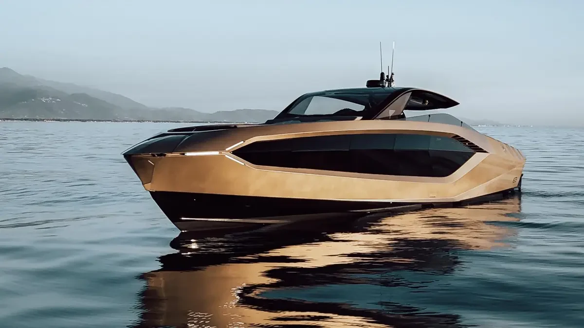 Gold Lamborghini 63 at rest with its angular bow in view