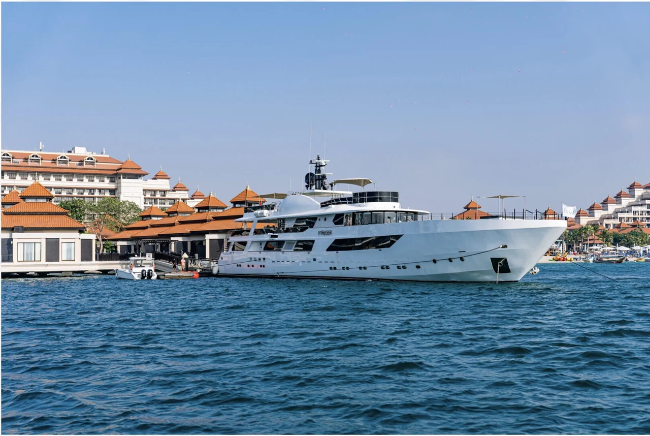 Finesse moored beside a waterfront resort