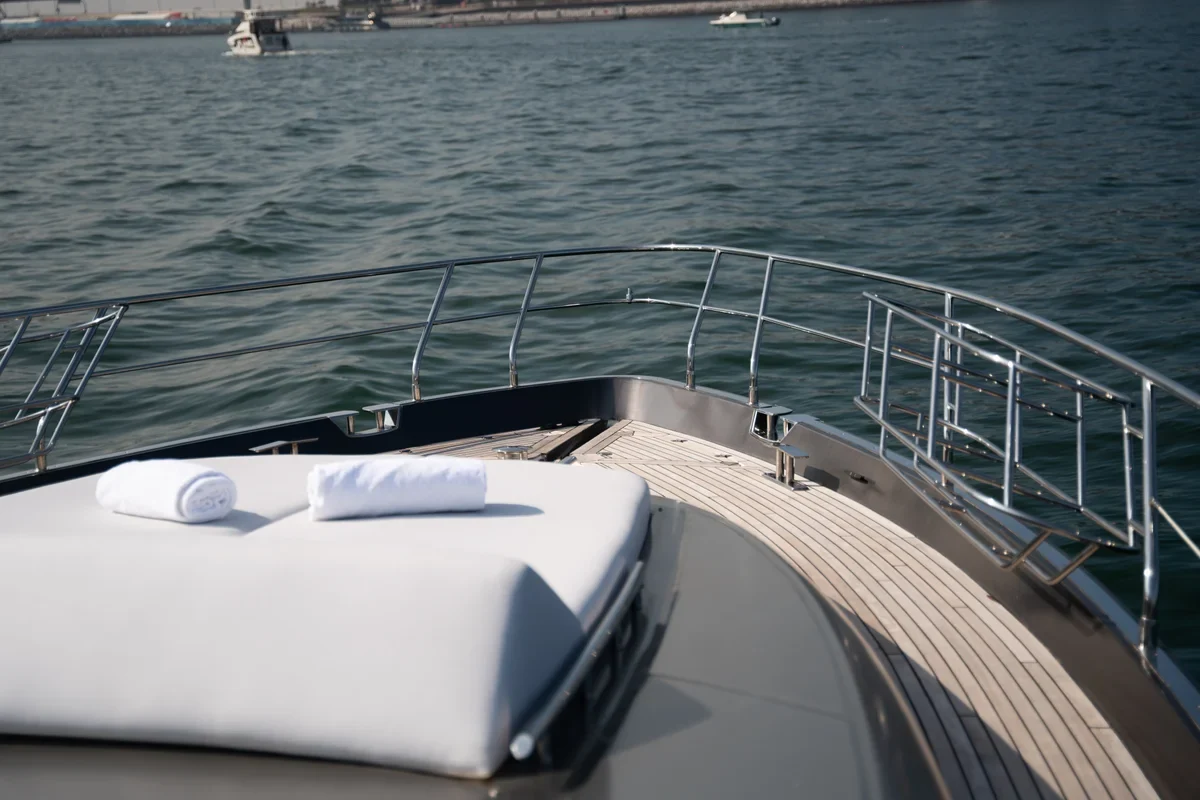 Bow sunpad and curved teak foredeck aboard Morrigan