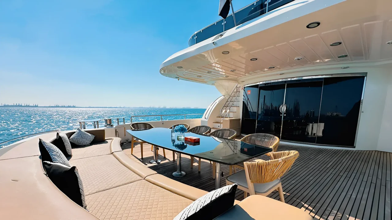 Outdoor dining table on the aft deck of Stardom