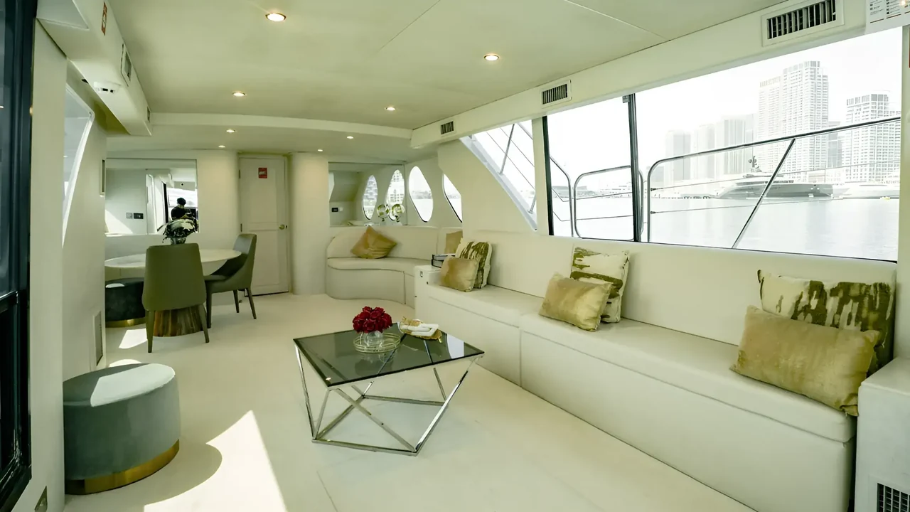 Window-lined saloon aboard Xclusive 24