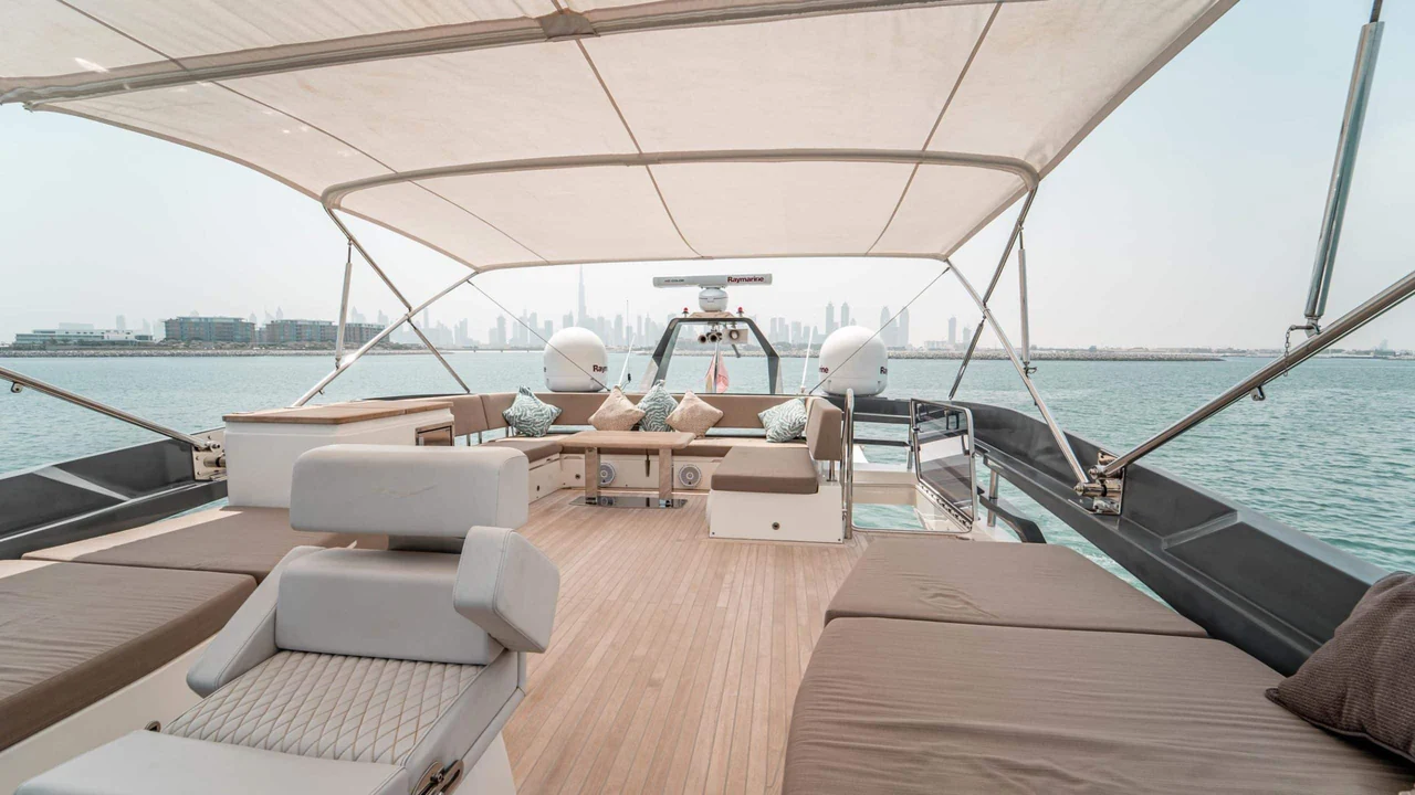 Shaded flybridge seating and sunpads aboard Dolce Vita