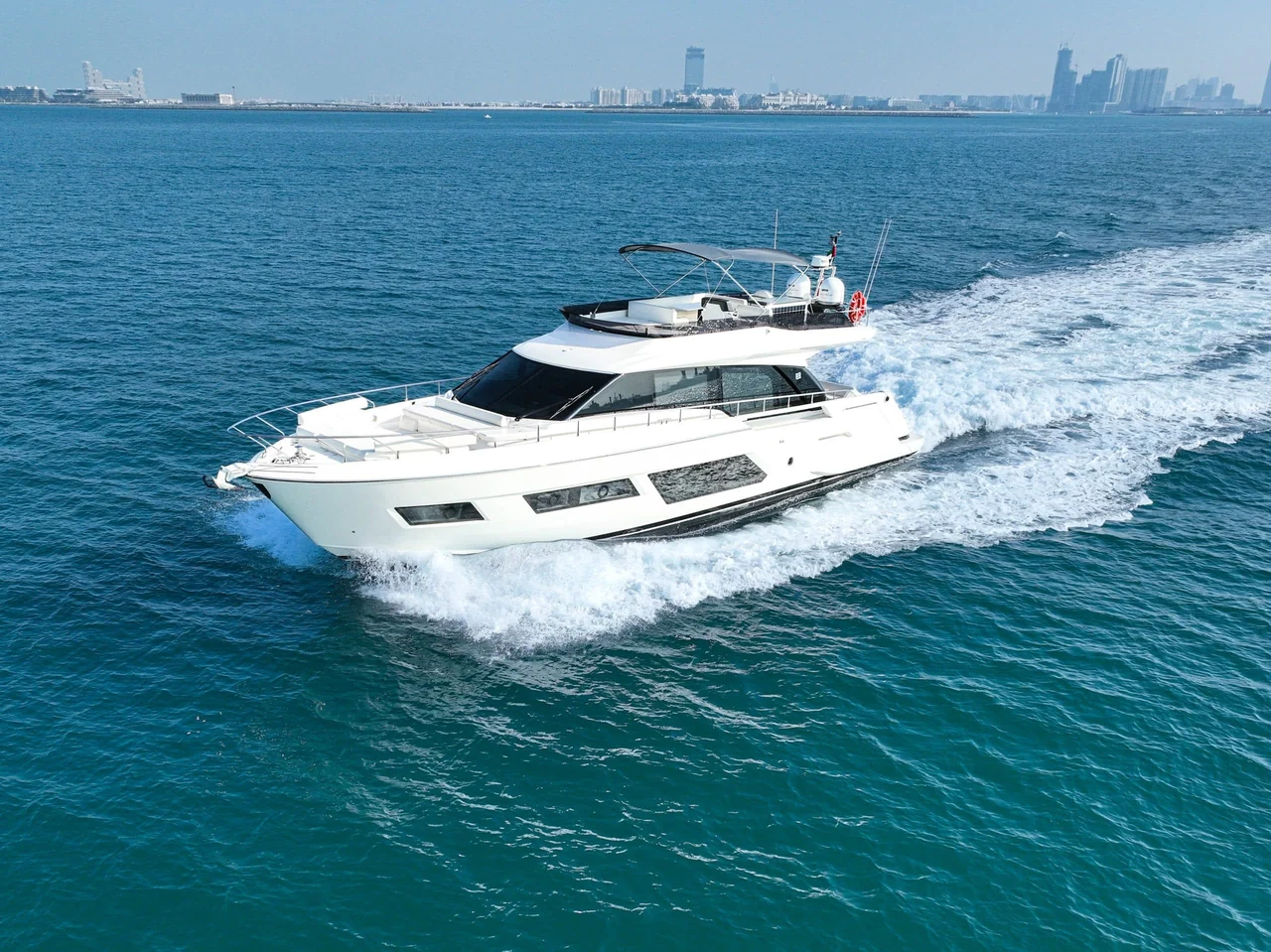 Ferretti 670 underway with its flybridge and bow in view