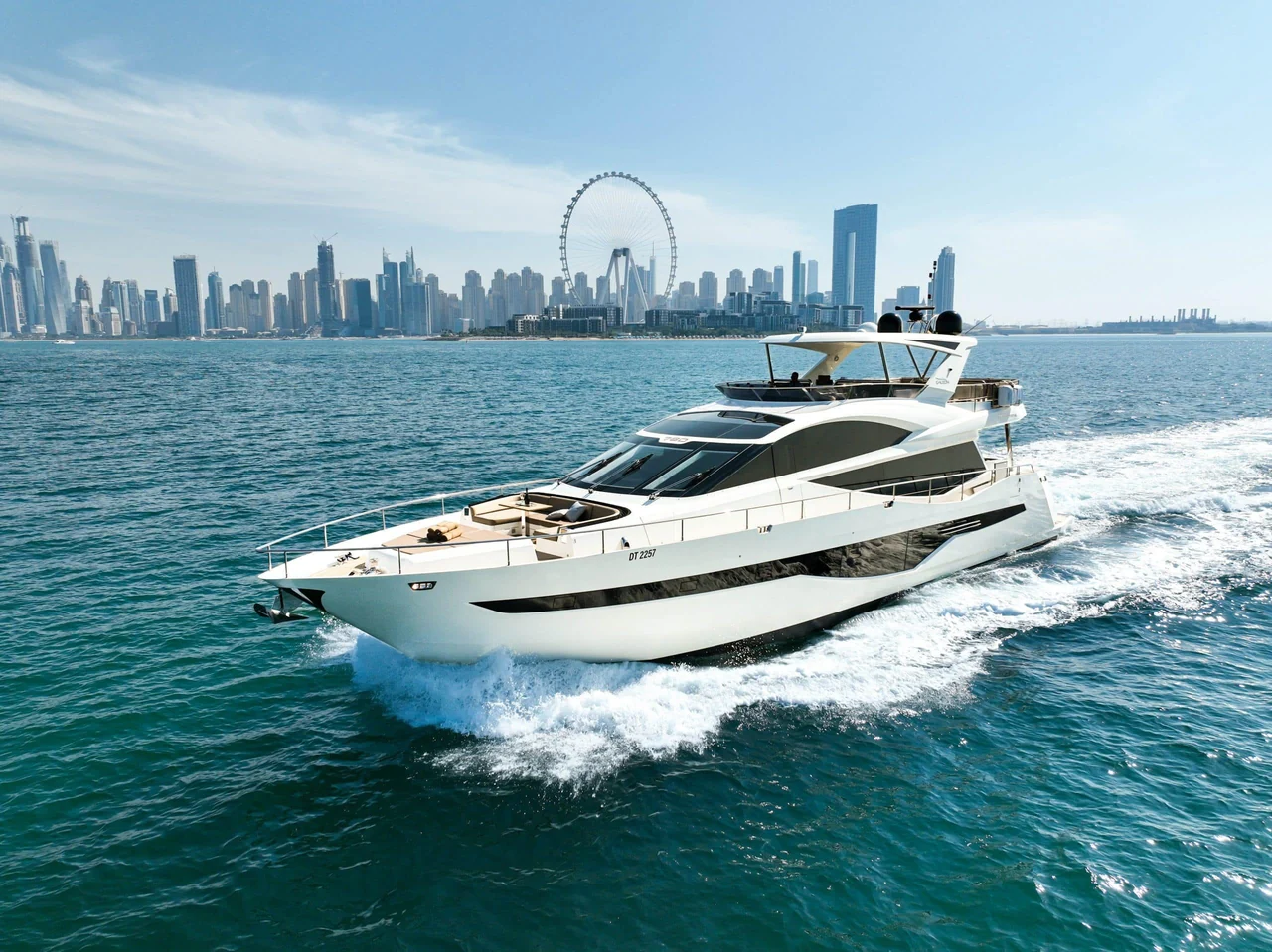 Galeon 780 cruising with the Dubai skyline in the distance