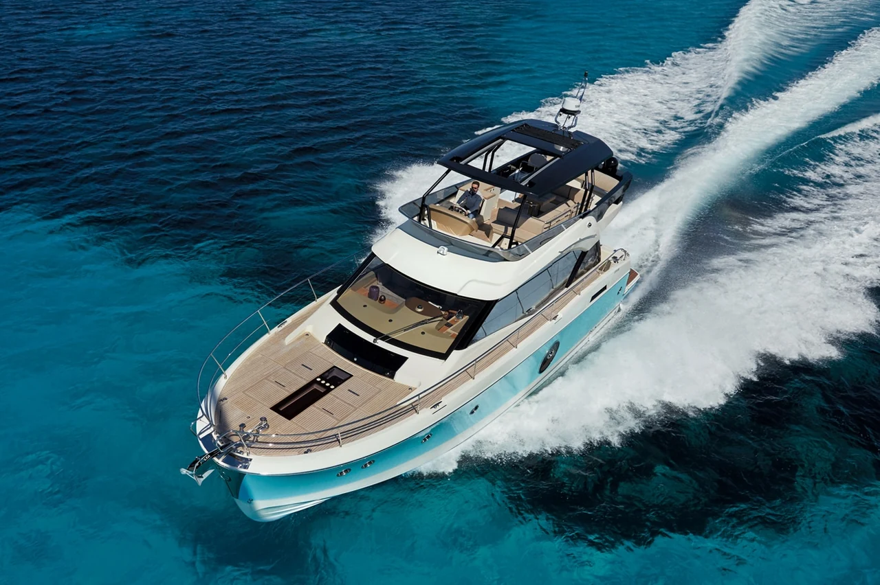 Overhead view of Monaco 60 cruising with a white wake
