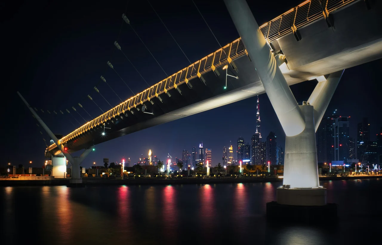 Dubai Water Canal footbridge and the city skyline at night