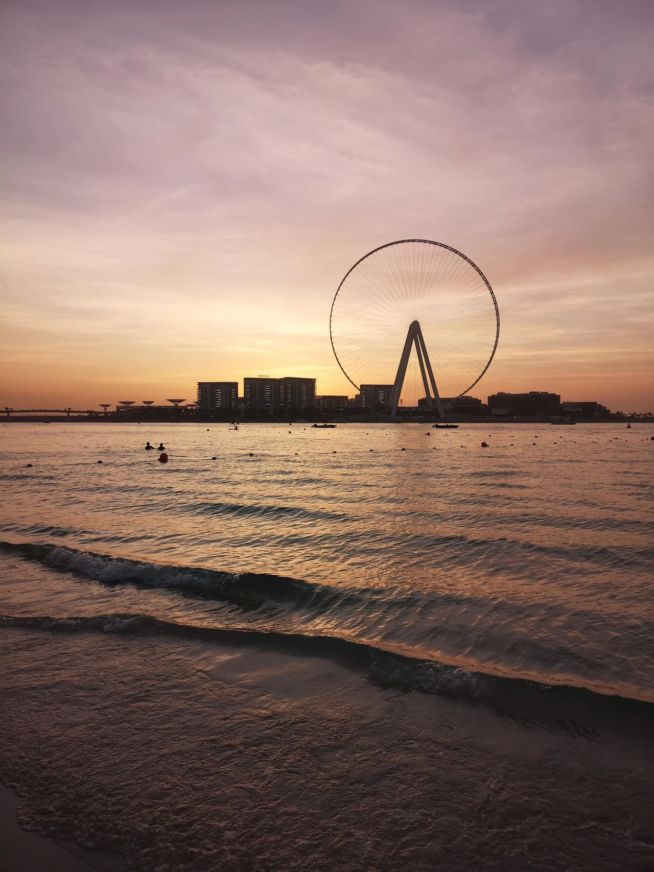 Ain Dubai on Bluewaters Island seen from JBR beach at sunset