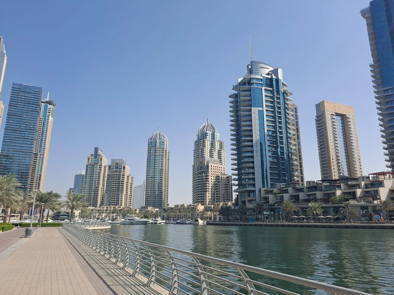 Dubai Marina waterfront and yachts beside the promenade