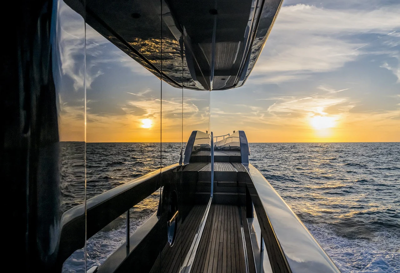 Side passage of Riva 82 at sunset