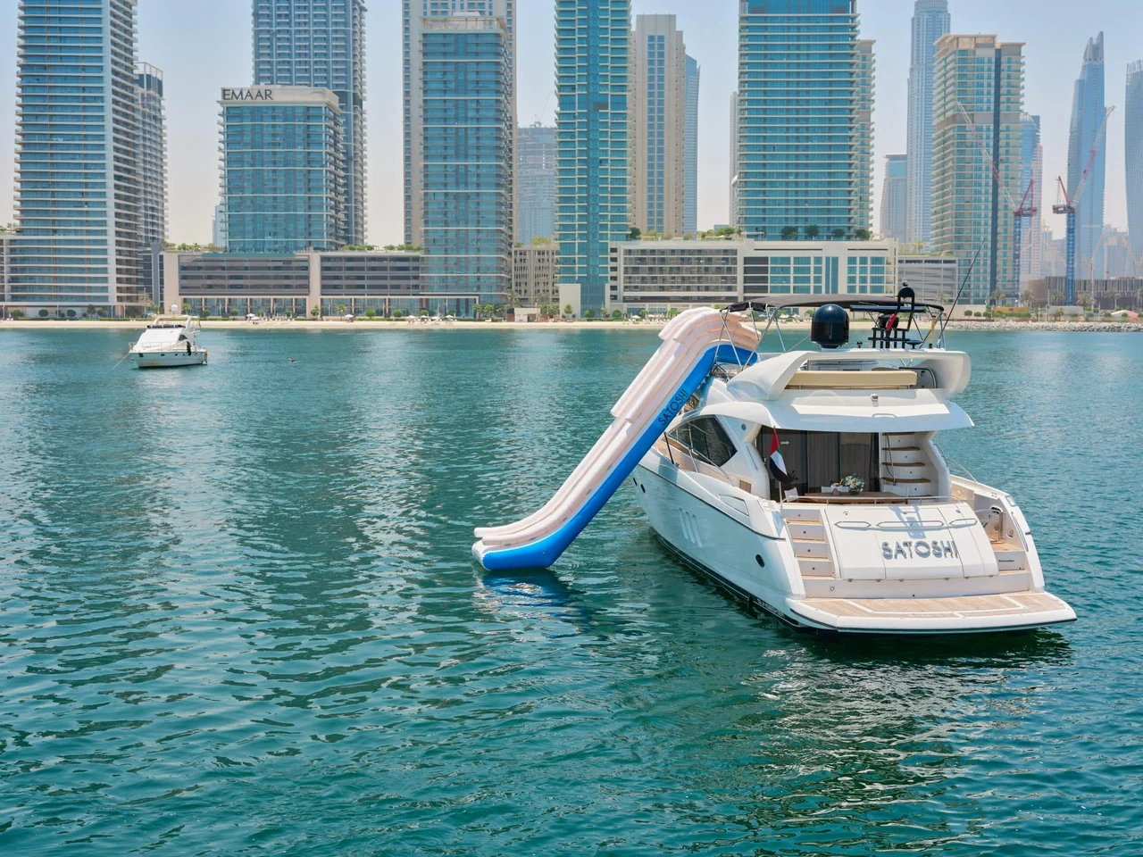 Stern view of Sunseeker Satoshi 70 with an inflatable waterslide