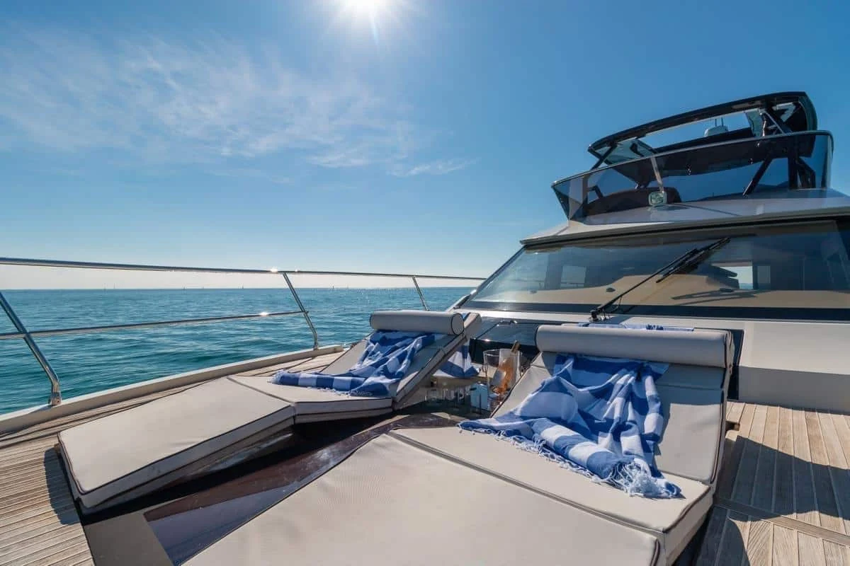 Bow sun cushions and teak deck on Monaco 60