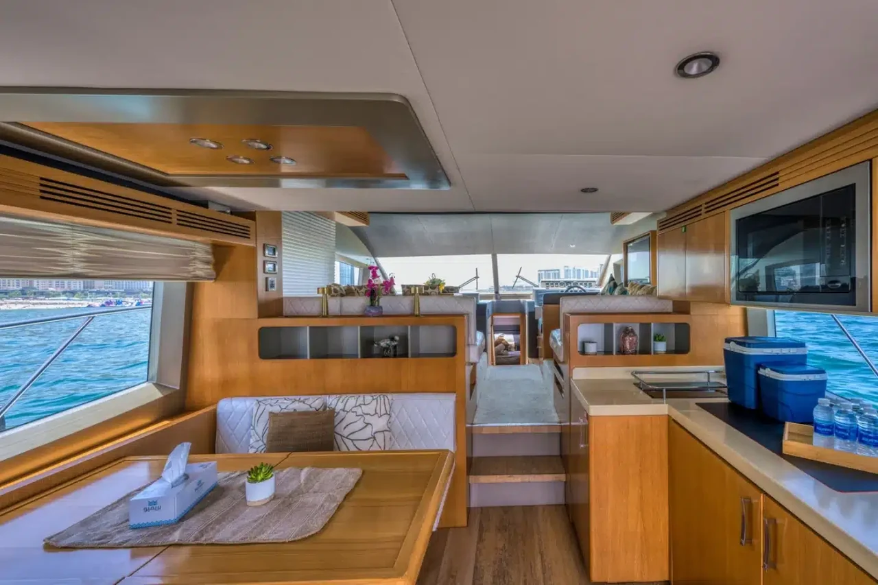 Salon seating beside wooden cabinetry on Anna 50