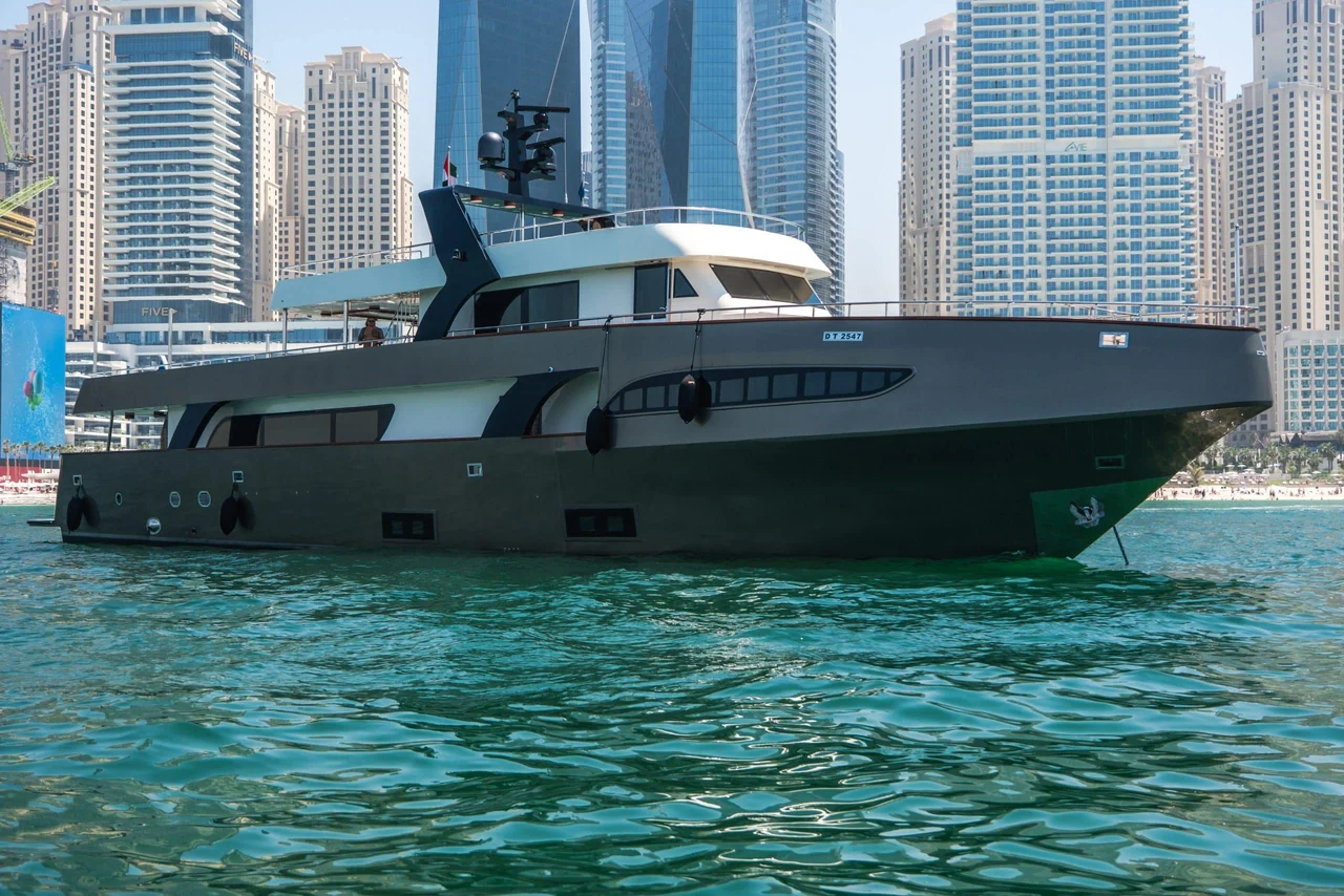 Side profile of Sapphire 150 beside Dubai's waterfront