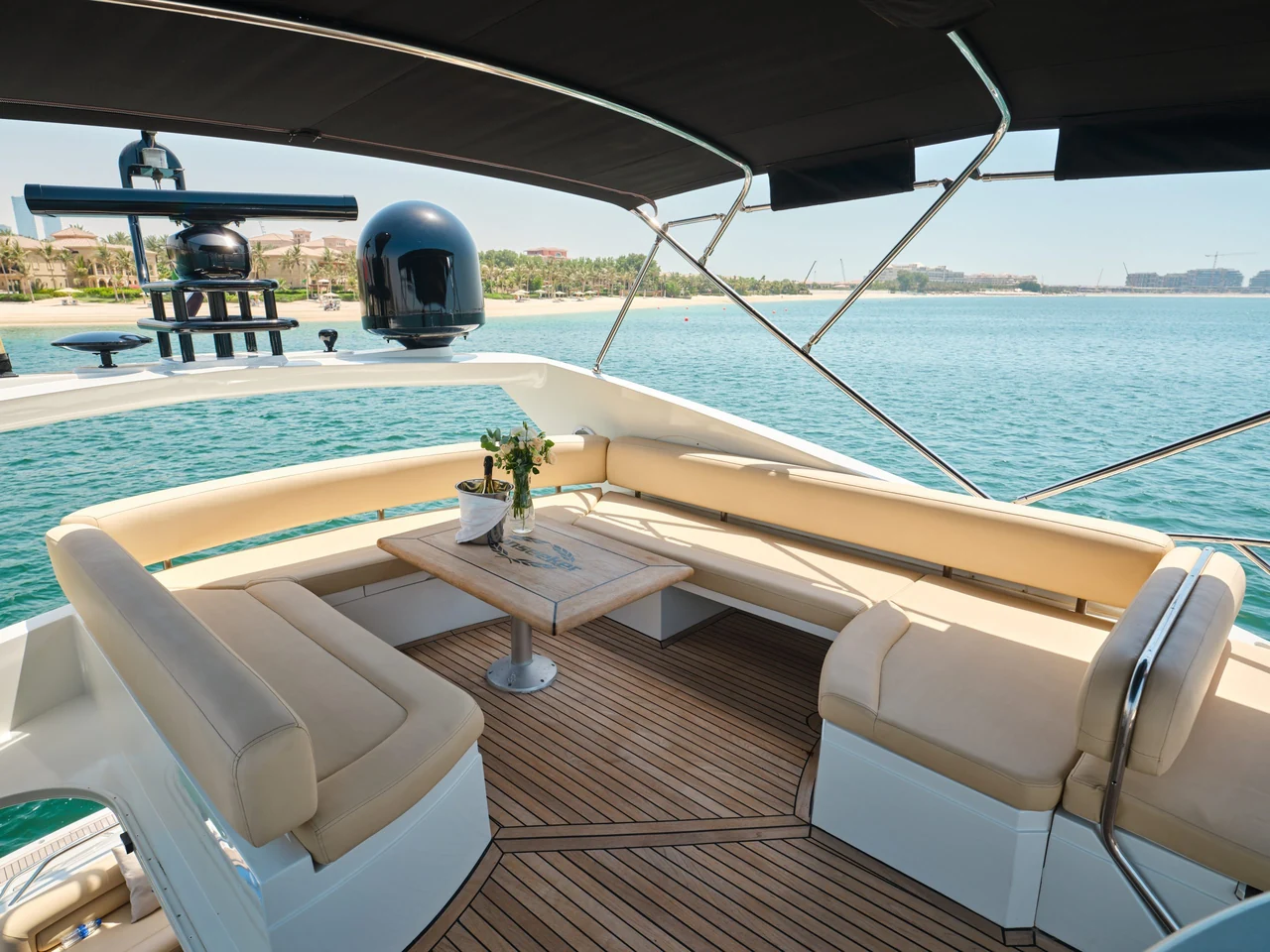 Shaded flybridge lounge and table on Sunseeker Satoshi 70