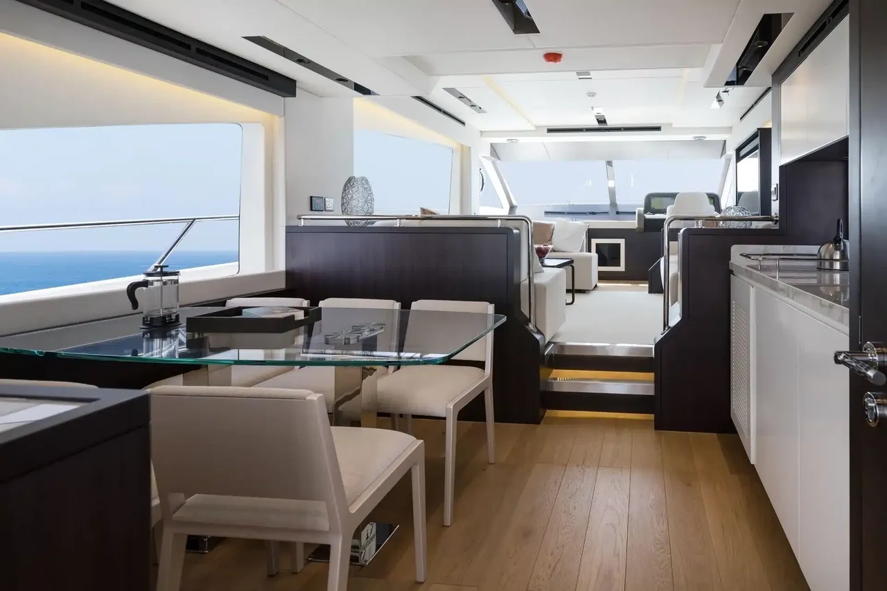 Salon dining table and forward helm on Alia 62