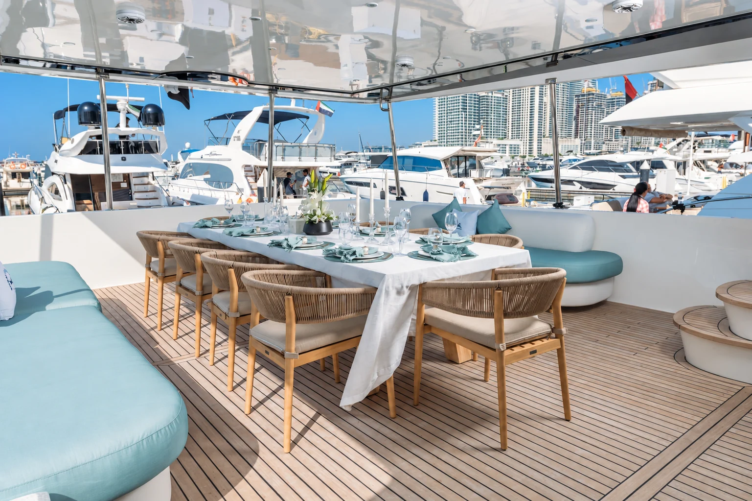 Luxury interior dining area on Eclipse yacht with elegant table setting and panoramic windows
