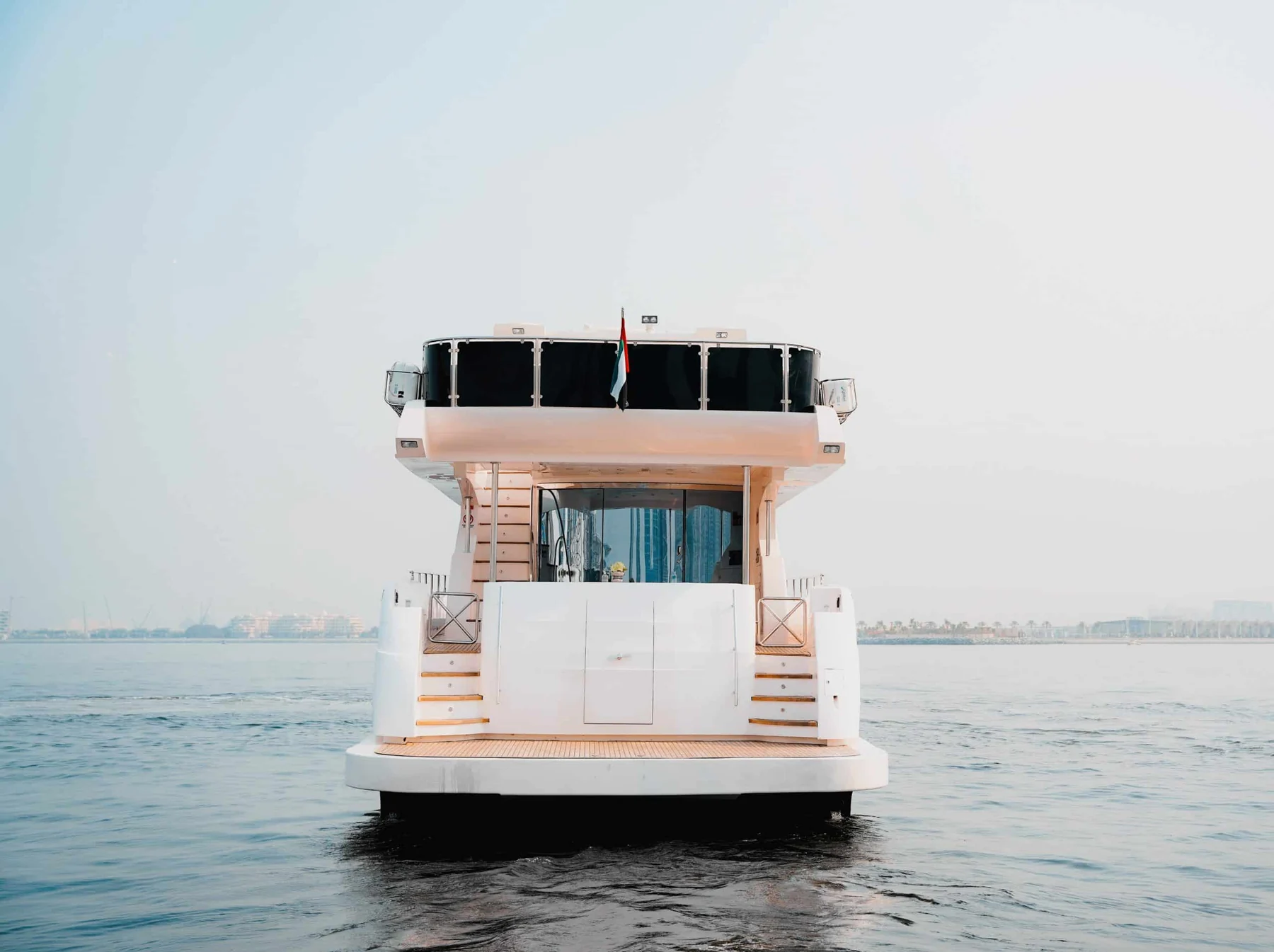 Front view of luxury yacht cruising on open sea for private yacht charter experience