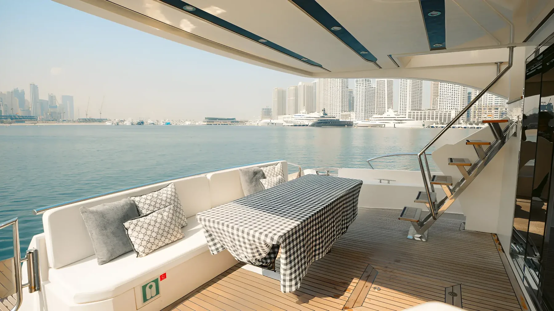 Covered aft deck dining of Xclusive 41